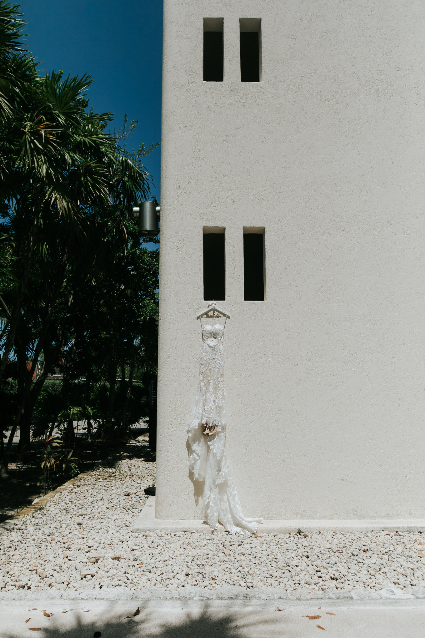 Wedding dress on white facade