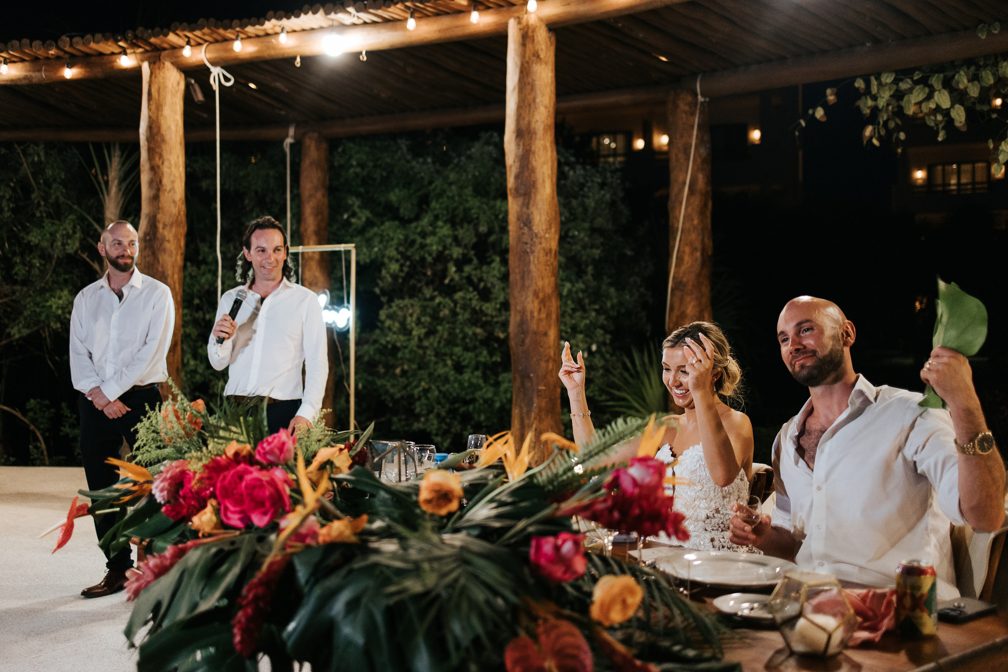 Reception speeches under string lights